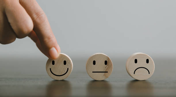 istock Satisfaction survey concept. Customer services best excellent business rating experience. Hand of business chooses a smile face on wood block circle. 5 Star Satisfaction. People feel great product. 1428562280