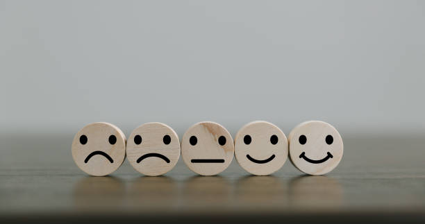 istock Satisfaction survey concept. Customer services best excellent business rating experience. Hand of business chooses a smile face on wood block circle. 5 Star Satisfaction. People feel great product. 1428562296
