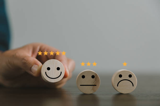 istock Satisfaction survey concept. Customer services best excellent business rating experience. Hand of business chooses a smile face on wood block circle. 5 Star Satisfaction. People feel great product. 1428562434