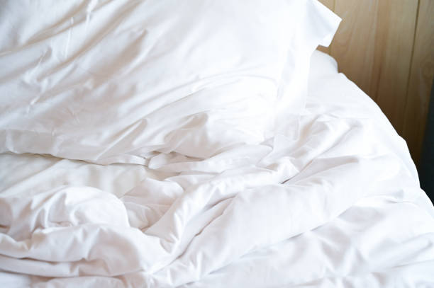 istock white bed and pillows in the room 1428567248