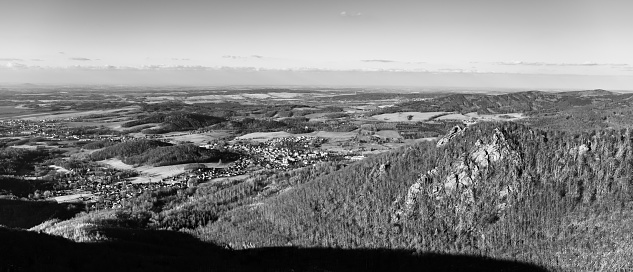 Oresnik granite rock formation in Jizera Mountains. Early spring time. View from Krasna Mari lookout point. Czech Republic. Black and white image.