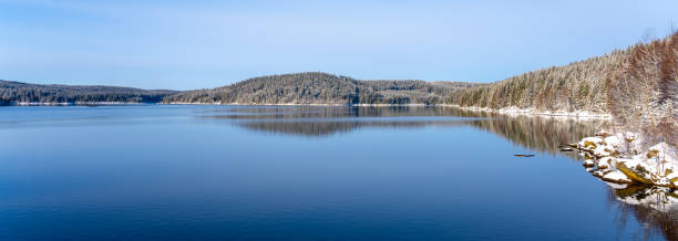 istock Winter scenery with mountain forests and water reservoir 1428572109