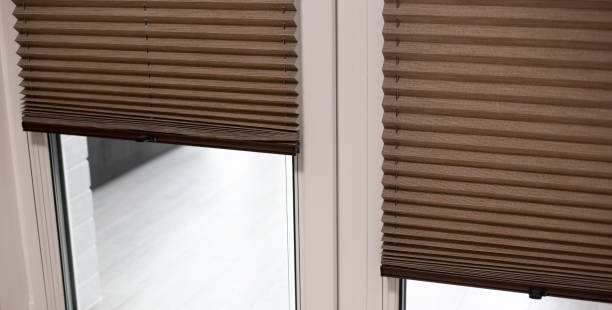 istock Pleated blinds close up on the window 1428572431