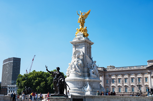 London, United Kingdom - August 06, 2022. Tourists around Queen Victoria memorial near Buckingham palace