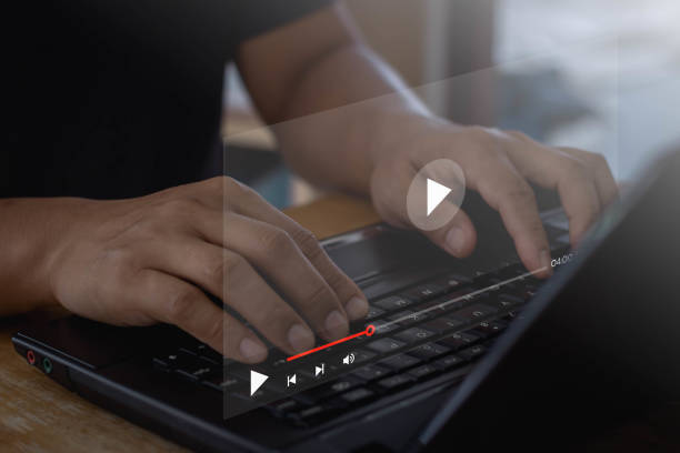 istock Businessman hands using laptop computer for streaming online, watching video on internet. Video streaming online, live concert, show or tutorial, Concept about subscription based live digital stream. 1428575220