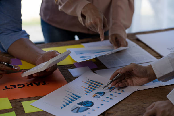 istock Diverse Startup Teamwork and Integration Ideas: Business Team Coworker Brainstorm Business Ideas Close group discussions with paper on the table plan to work with colleagues in the office. 1428581287
