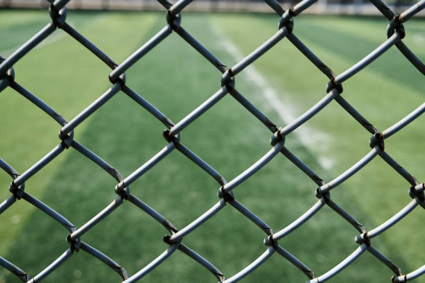 istock wire mesh around football field 1428587940