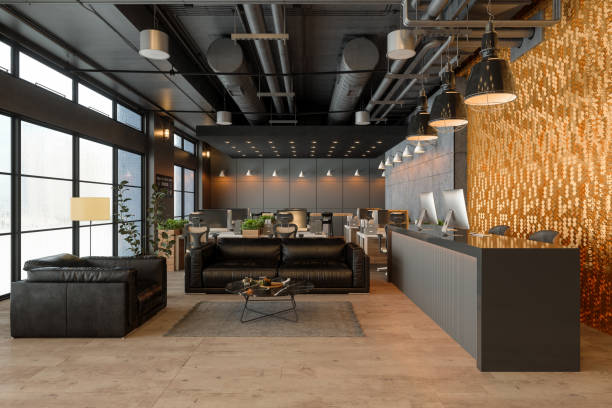 istock Waiting Area Of Open Plan Office With Reception Desk, Office Tables And Leather Sofa 1428594019