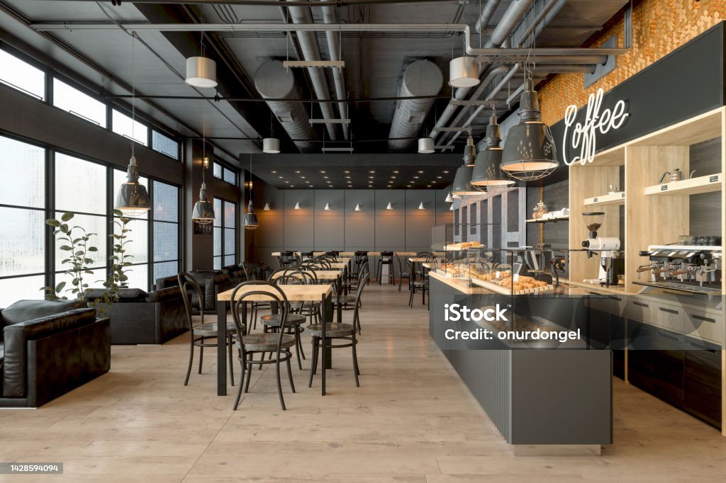 Empty Coffee Shop Interior With Wooden Tables, Coffee Maker, Pastries And Pendant Lights Restaurant Stock Photo