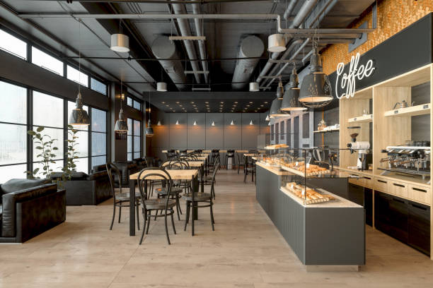 puste wnętrze kawiarni z drewnianymi stołami, ekspresem do kawy, ciastkami i lampami wiszącymi - bufet restauracja zdjęcia i obrazy z banku zdjęć