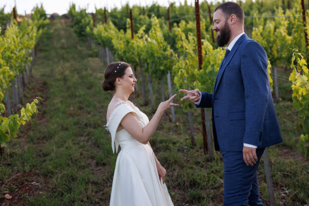 istock Young wedding couple having fun in vineyard 1428600370