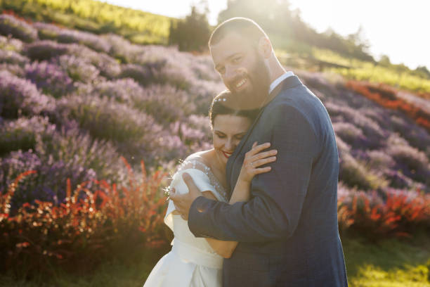 istock Happy just married couple hugging in lavender field 1428600757