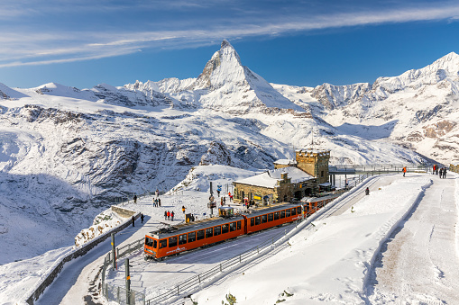 Mer de Glace, France – February 21, 2023: Visiting the glacier valley Mer de Glace on the Mont Blanc massif on a sunny day in winter.