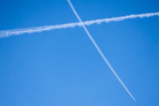 Contrail Lines of Planes on Blue Sky - Conspiracy Theory Chem trails