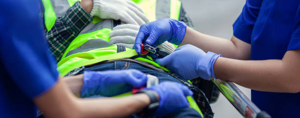 Selective focus of paramedic team locking belt near patient on stretcher for moving to hospital. stock photo