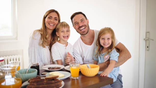 istock Parents with their kids in dining room having breakfast together 1428615074