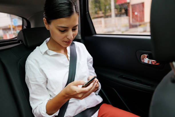 istock Woman using phone during road trip 1428615079