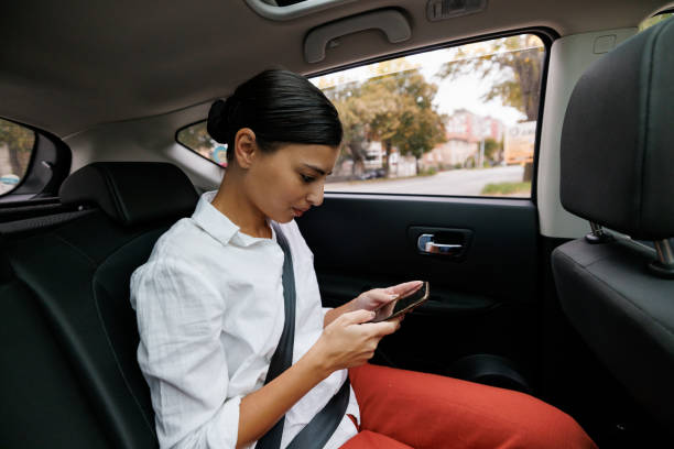 istock Woman using phone during road trip 1428615209