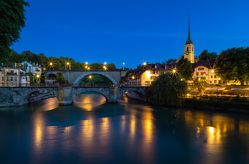 Image of bridges on the Aare River in Bern, capital city of Switzerland, during twilight blue hour.