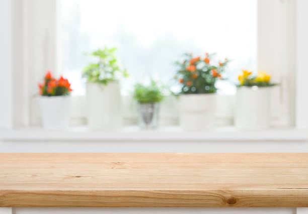 Wood table top on blurred abstract background of window sill stock photo