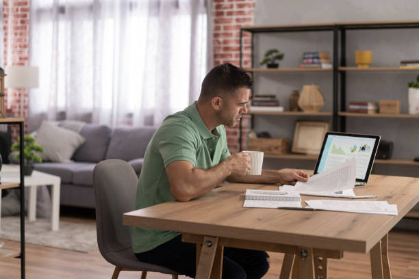 istock Men doing online learning on a laptop while staying at home. 1428625805