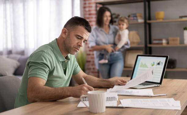 istock Men doing online learning on a laptop while staying at home. 1428625869