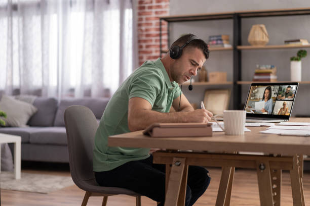 istock Men doing online learning on a laptop while staying at home. 1428625908