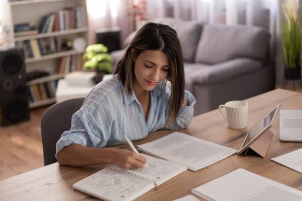 istock Women doing online learning on a digital tablet while staying at home. 1428625939