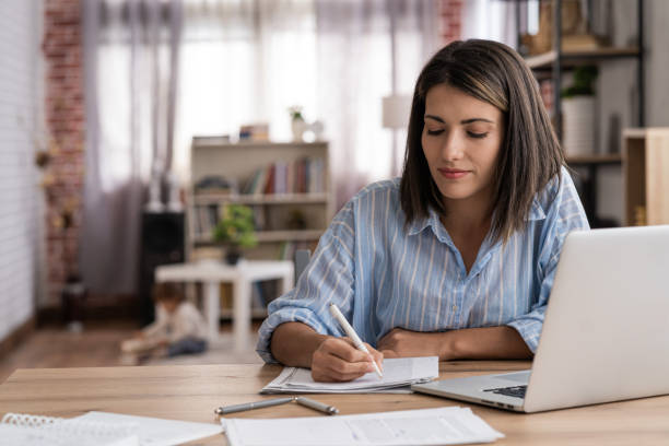 istock Women doing online learning on a laptop while staying at home. 1428626099
