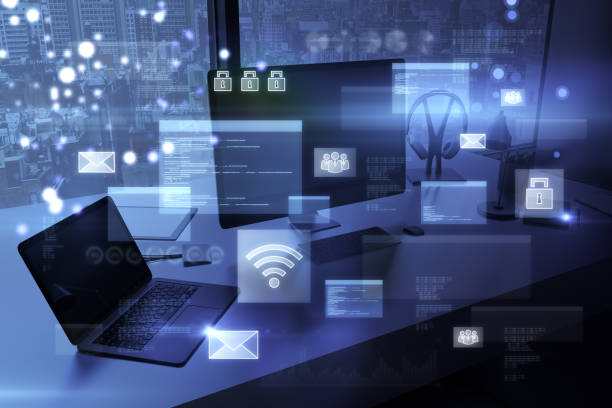 istock Close up of office workplace with computer monitors and abstract glowing digital transformation hologram on blurry background. Double exposure. 1428628760