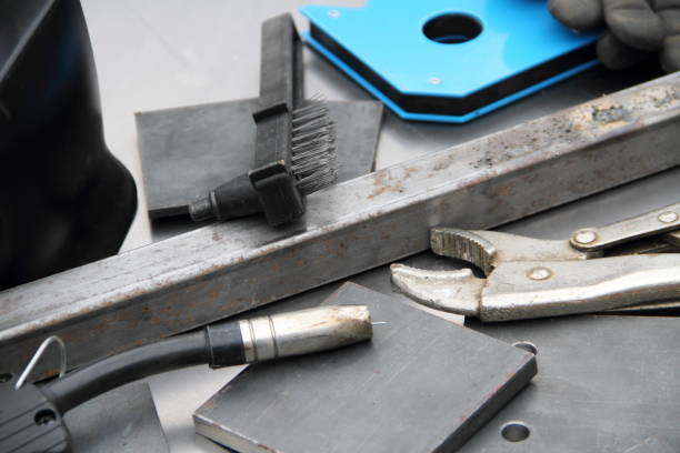 istock Welding equipment with steel and accessories on a workbench 1428628841