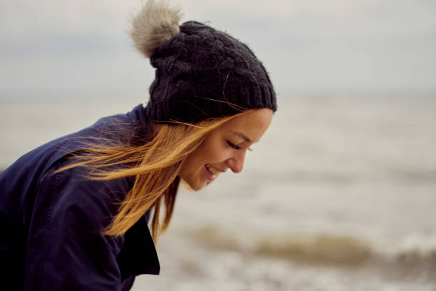 istock Mid adult woman on beach 1428632826