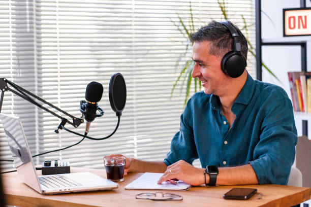 istock male podcaster live streaming show 1428634628