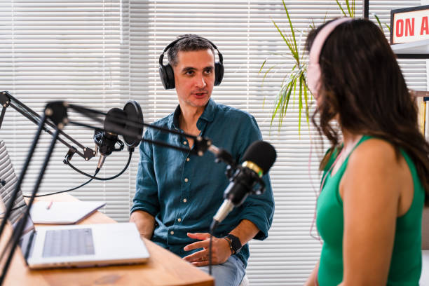 istock interview and discussion between a blogger and a guest on a live podcast show 1428636527