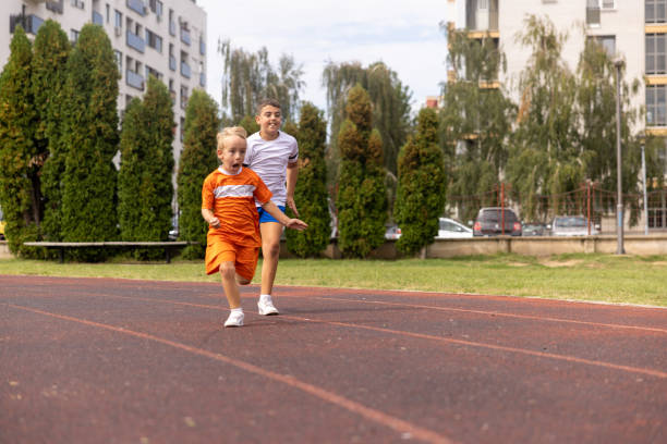 istock Boys running on the track in the city. 1428636620