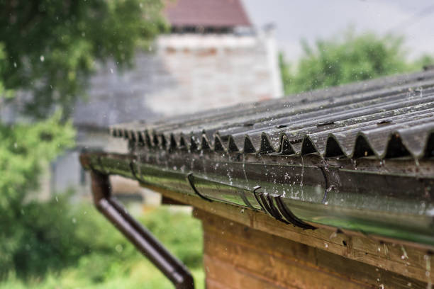 istock Streams of rain are flowing down from the roof. 1428637601