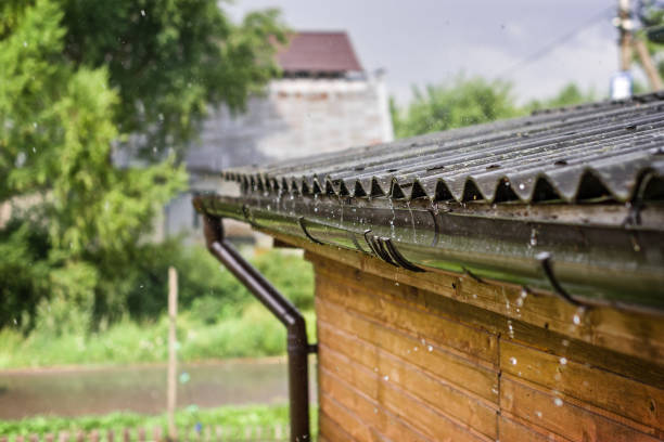 istock Streams of rain are flowing down from the roof. 1428637603