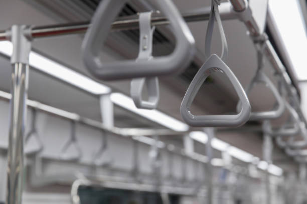 istock Handles for standing passenger inside in the subway train. Subway or Metro Handrail, Hand holding blue Handrail 1428638728