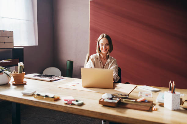 istock A Happy Beautiful Teacher Sitting In The Classroom And Working O 1428639821