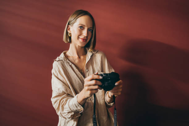 istock A Beautiful Charming Photographer Looking At Camera 1428639846