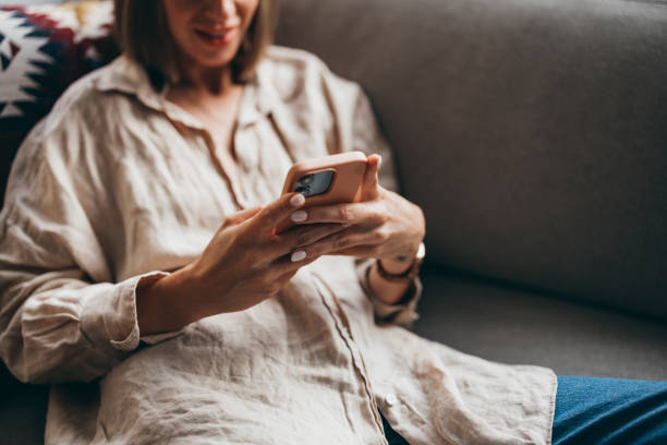 istock An Unrecognizable Beautiful Businesswoman Relaxing At Home Using Her Mobile Phone 1428639936