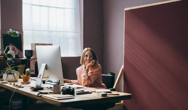 istock A Happy Beautiful Businesswoman Looking At Camera While Working 1428640053
