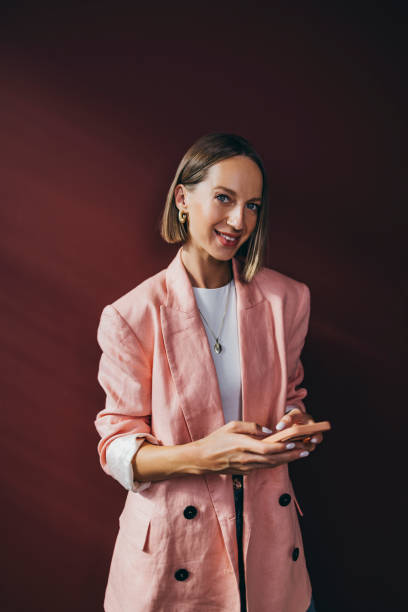 istock A Beautiful Businesswoman Looking At Camera While Holding Her Mo 1428640150