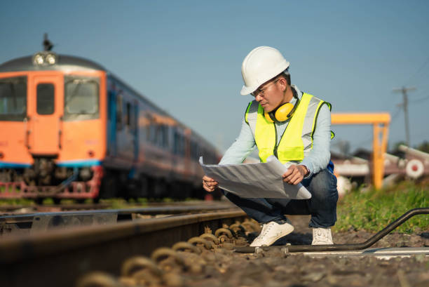 istock The engineer in a helmet and uniform working on the railway station. 1428643571