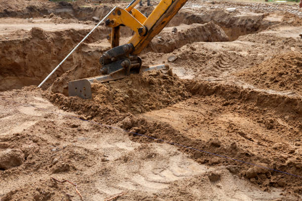 istock The excavator digs a pit under the foundation foundation for building a house 1428646573
