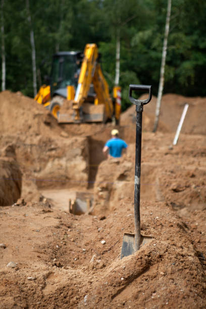 istock The excavator digs a pit under the foundation foundation for building a house 1428646585