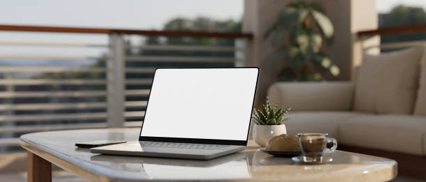 istock Close-up, Notebook laptop mockup and decor on modern coffee table in modern living room. 1428647784