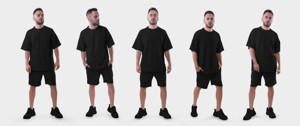 istock Black t-shirt mockup, oversized shorts on a posing brutal guy in sneakers, front, isolated on background. Set 1428648512