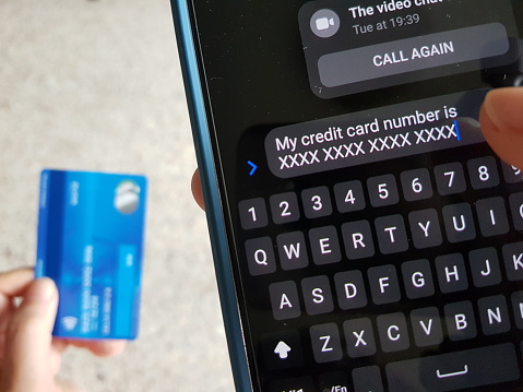 Online scam victim sending credit number to scammer