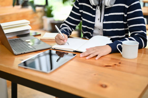 istock Asian female college student doing homework in the library. cropped shot 1428649253